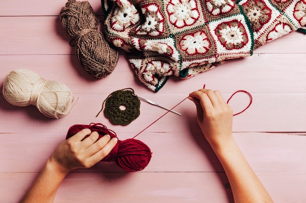 Hands working with wool