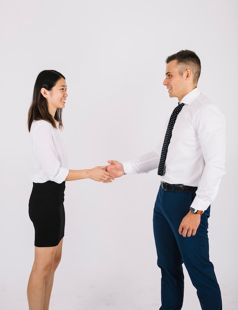 Handshake concept between businessman and businesswoman