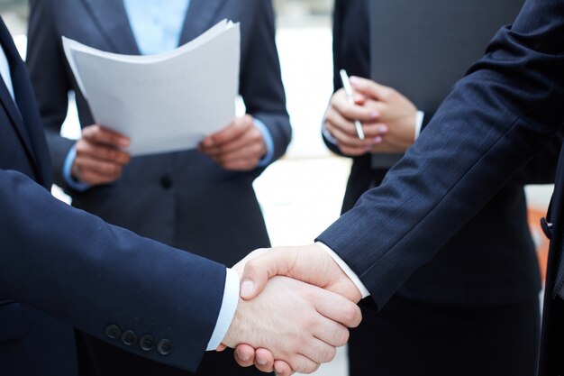 Handshake of executives greeting each other