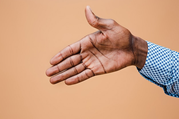 Handshake. Hands of businessman isolated on brown