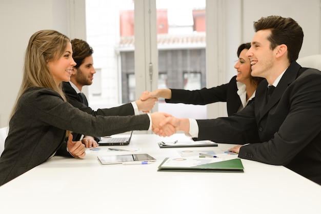 Handshakes in a meeting at the office