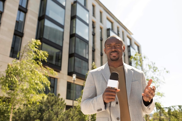 Free photo handsome african american male journalist