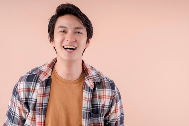 Handsome asian attractive male face close up casual dress laugh and big smile happiness surprise expressionpretty asian man toothy smile wide mouth color background