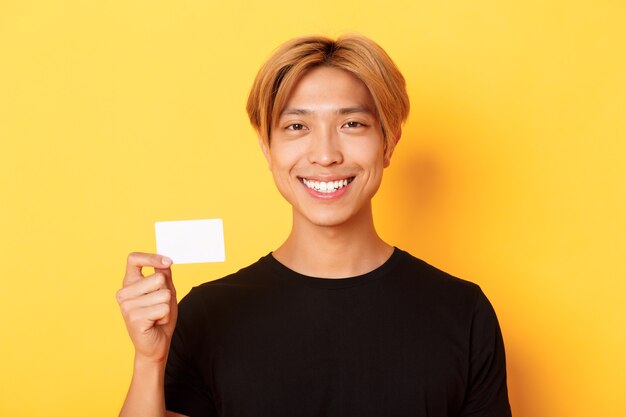 Handsome Asian blond guy posing