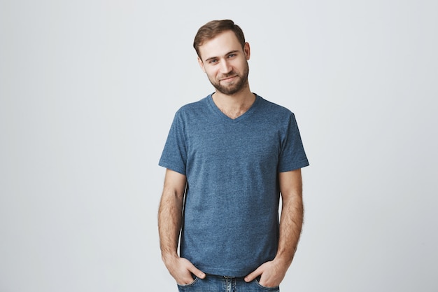 Handsome bearded man smiling happy