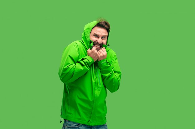 Free Photo | Handsome bearded young man isolated on green
