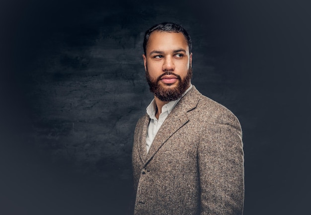 Free Photo | A handsome Black male dressed in a suit from a wool.