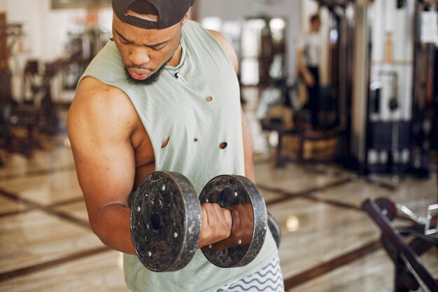 A handsome black man is engaged in a gym