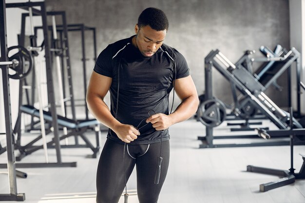 A handsome black man is engaged in a gym