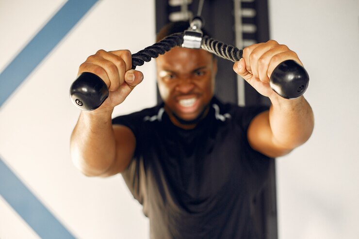 Free Photo a handsome black man is engaged in a gym