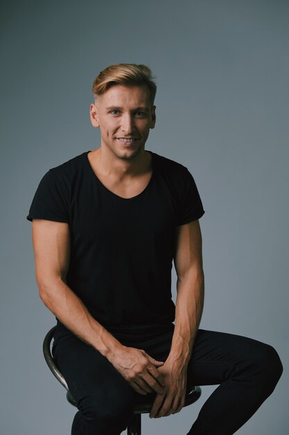 Handsome blond young man posing at studio