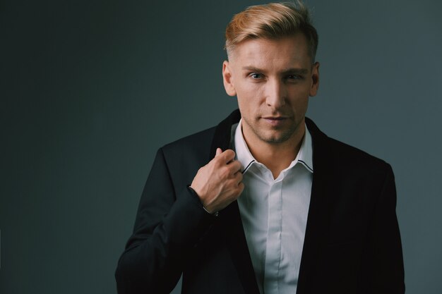 Handsome blond young man posing at studio