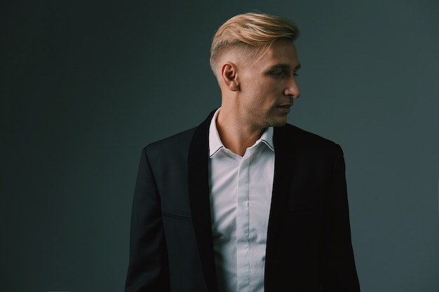 Handsome blond young man posing at studio