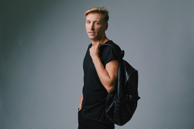 Handsome blond young man posing at studio