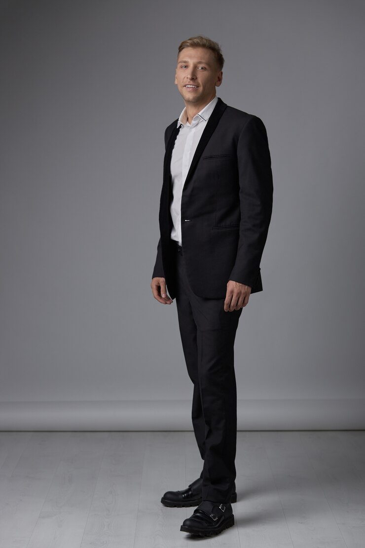Free Photo handsome blond young man posing at studio