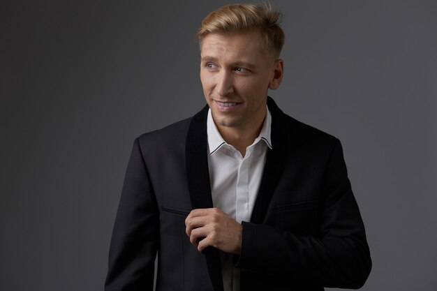 Handsome blond young man posing at studio