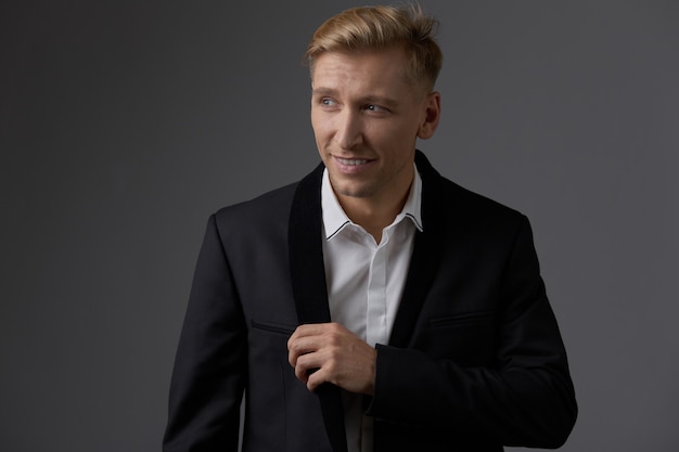 Handsome blond young man posing at studio