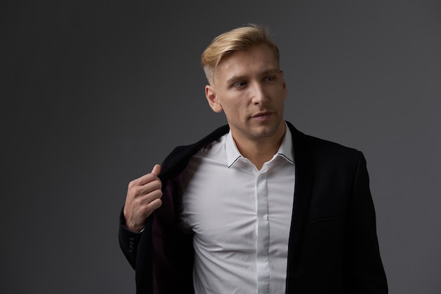 Handsome blond young man posing at studio