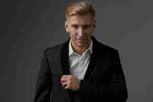 Free photo handsome blond young man posing