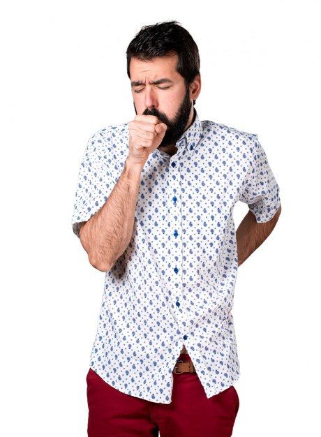 Handsome brunette man with beard coughing a lot