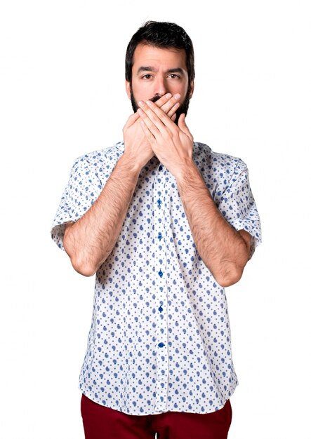 Handsome brunette man with beard covering his mouth