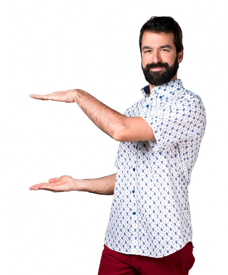 Free Photo handsome brunette man with beard holding something
