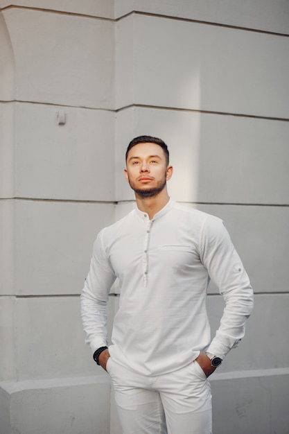 Handsome businesman in a summer city