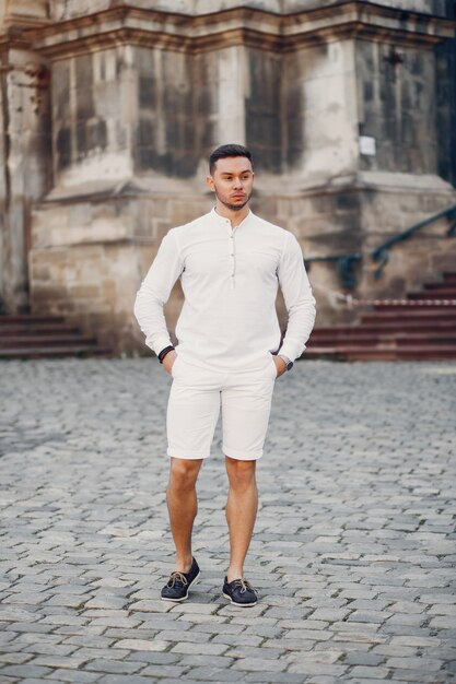 Handsome businesman in a summer city