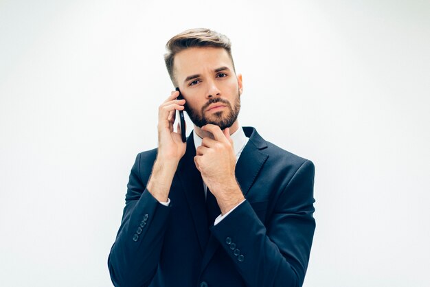 Handsome business guy with mobile phone