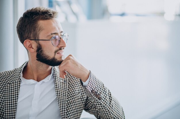 Handsome business man portrait in an office