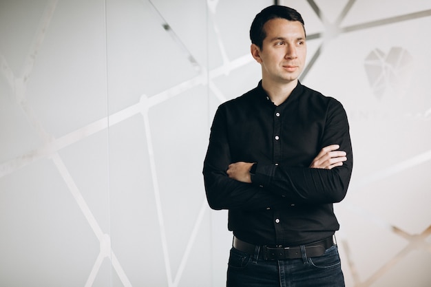 Handsome business man standing in office