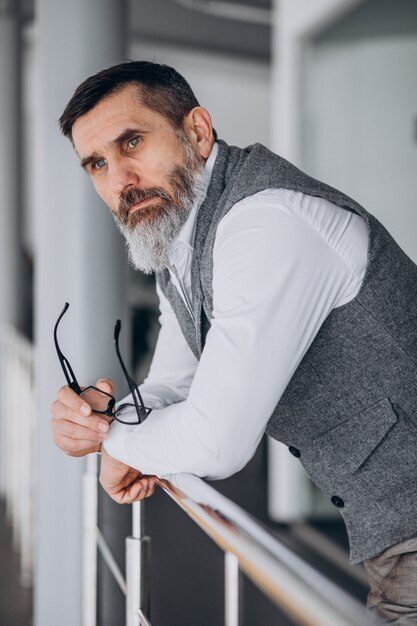 Handsome business man standing in office