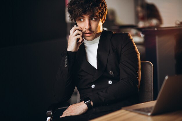 Handsome business man working on computer in office