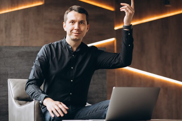 Handsome business man working on computer in office