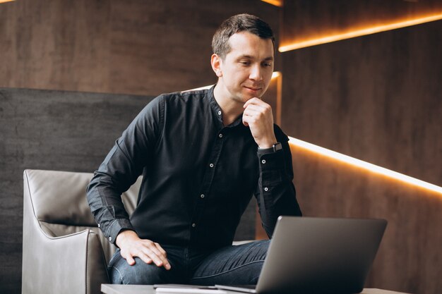 Handsome business man working on computer in office