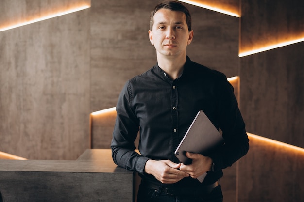 Handsome business man working with tablet in office