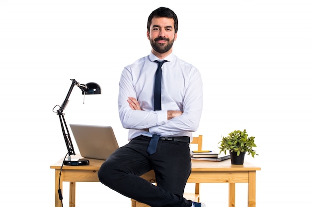 Free photo handsome businessman in his office