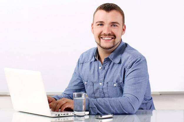 Handsome businessman at his workplace