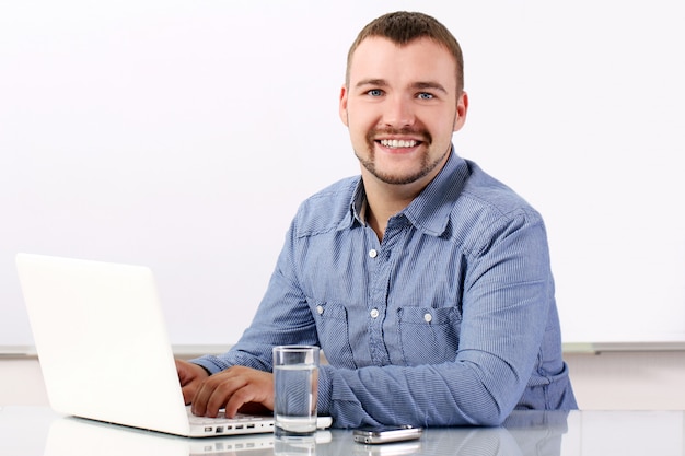 Handsome businessman at his workplace