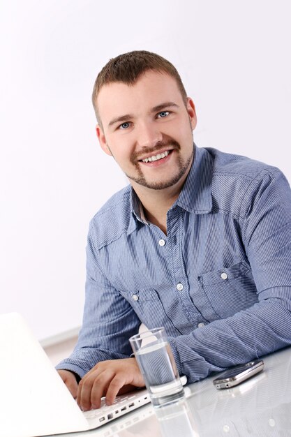 Handsome businessman at his workplace