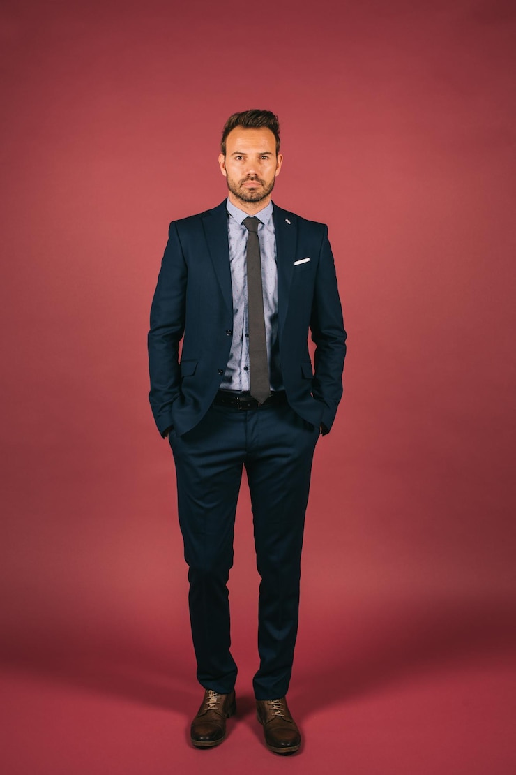Free Photo handsome businessman looking at camera
