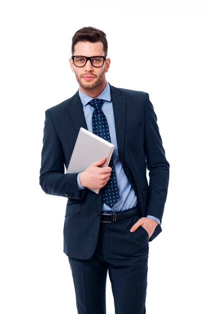 Handsome businessman in work with the digital tablet