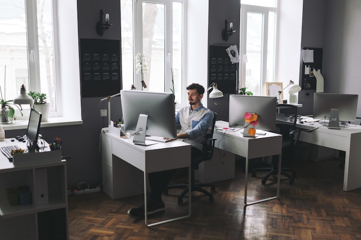 Free Photo handsome businessman working in office