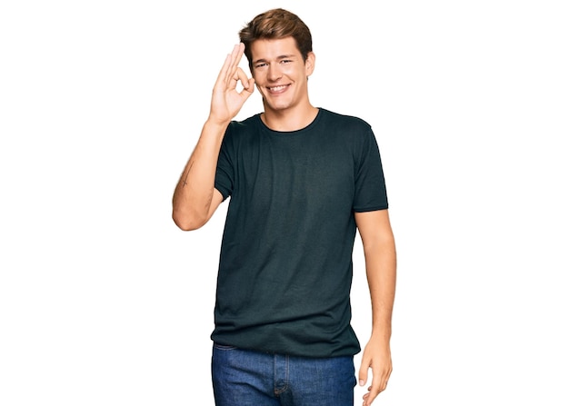 Handsome caucasian man wearing casual clothes smiling positive doing ok sign with hand and fingers. successful expression.