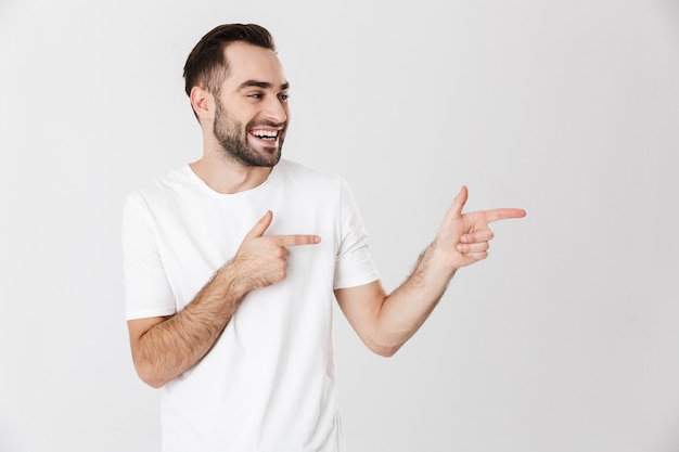 Premium Photo | Handsome cheerful man wearing blank t-shirt standing ...