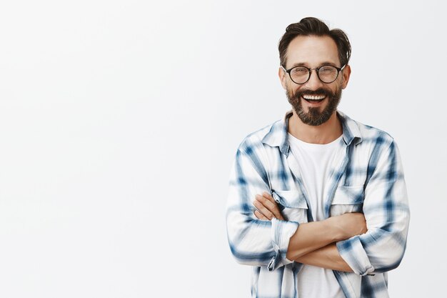 Handsome confident bearded mature man posing