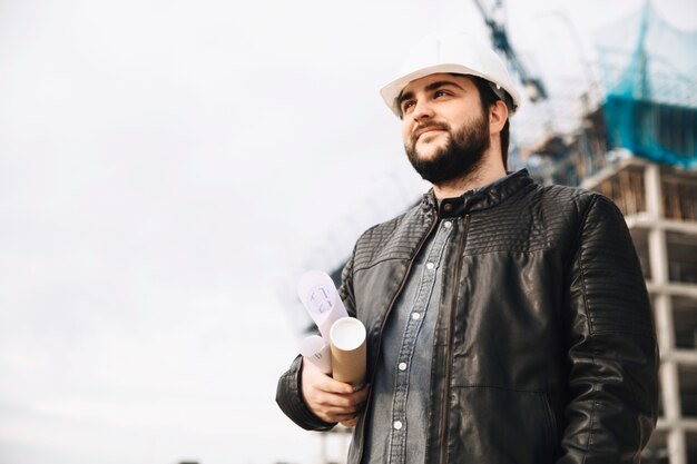 Handsome draftsman on construction site