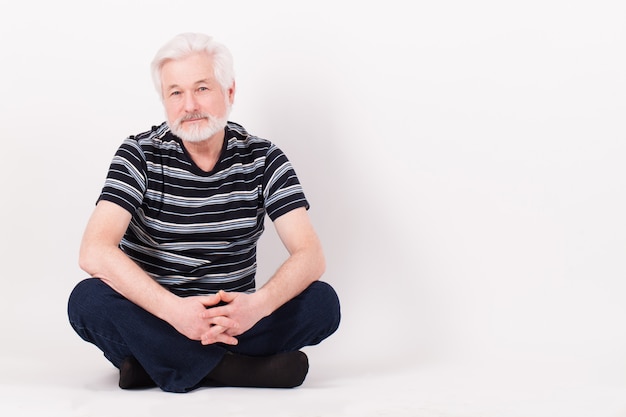 Handsome elderly man sitting