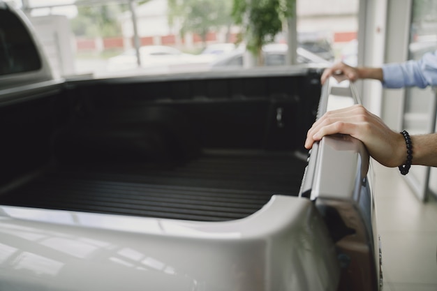 Handsome and elegant man in a car salon