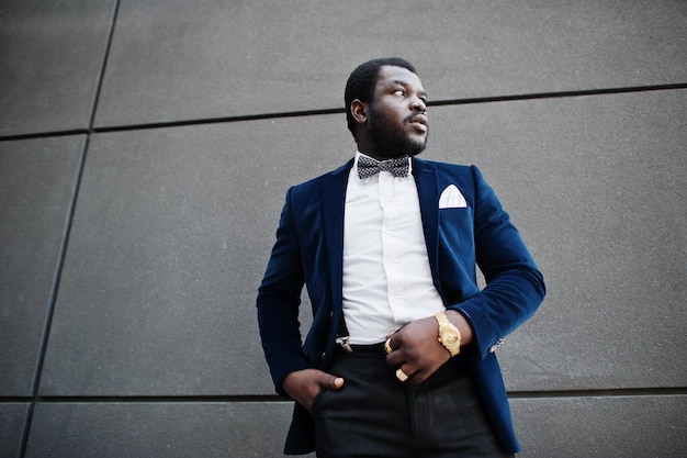 Handsome fashionable african american man in formal wear and bow tie